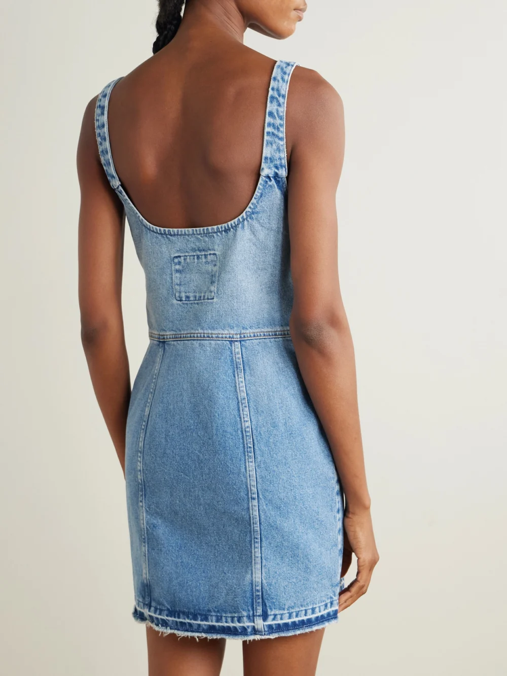 Back view of the Stella McCartney Frayed Paneled Organic Denim Mini Dress