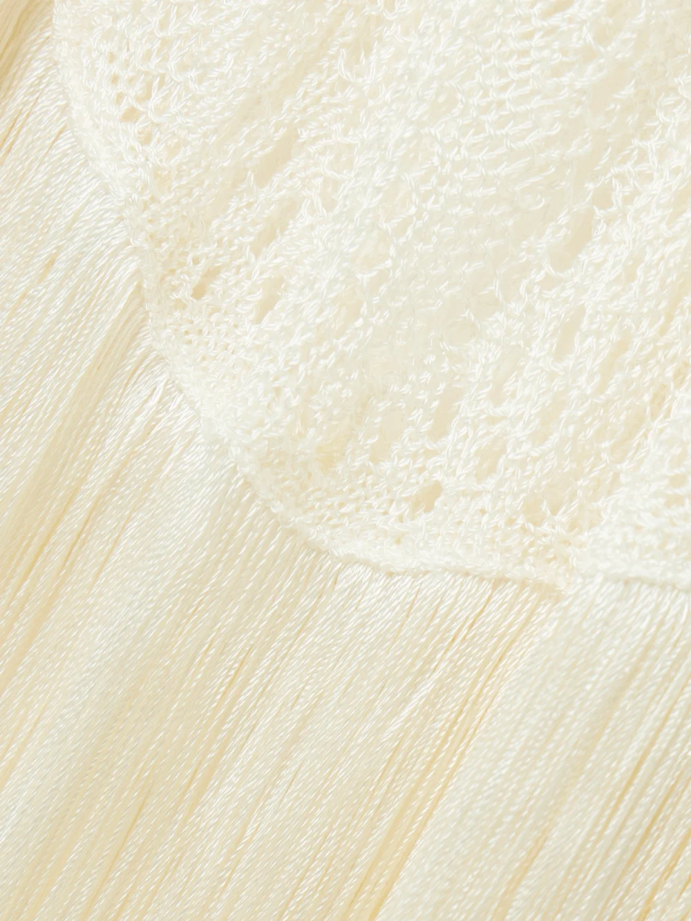 Close-up detail of the Stella McCartney Fringed Crocheted Maxi Dress
