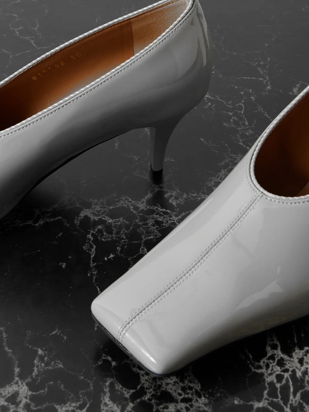 Close-up detail of the Stella McCartney Glossed Pumps
