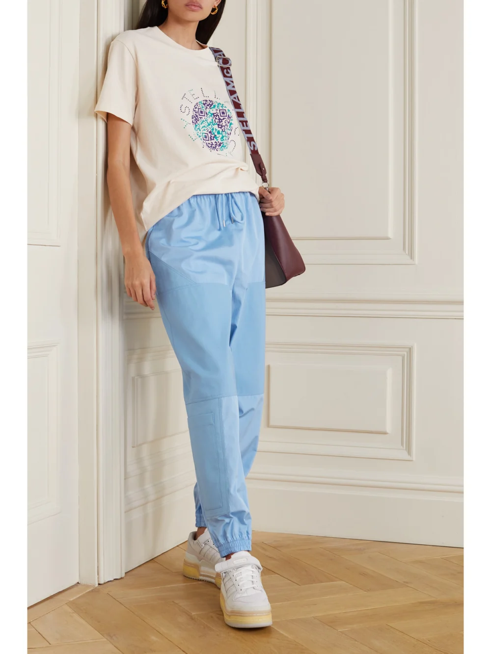 Stella McCartney Kara Paneled Organic Cotton-ripstop and Shell Track Pants, worn by a model