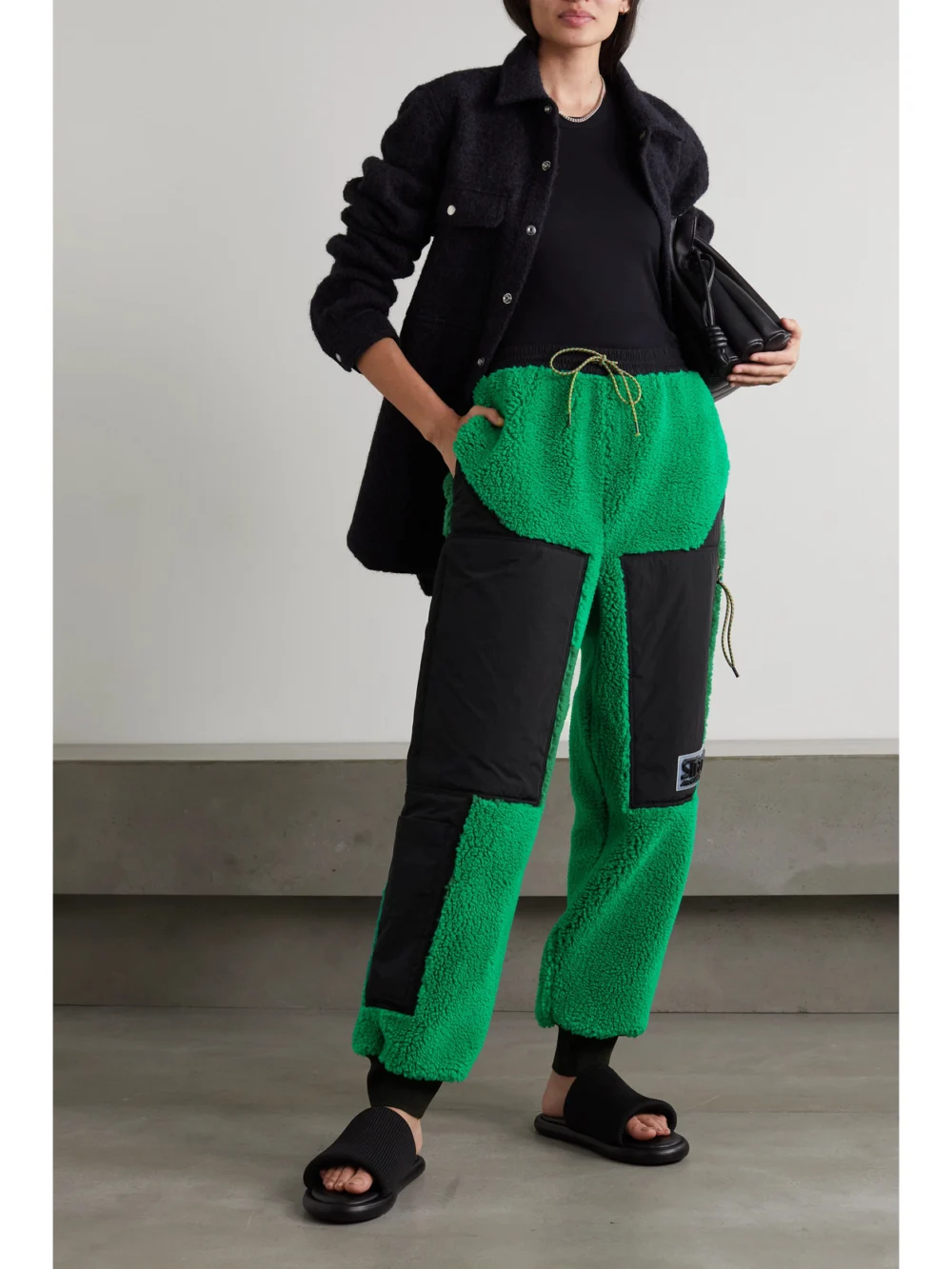 Stella McCartney Kara Recycled Faux Shearling and Shell Track Pants, worn by a model