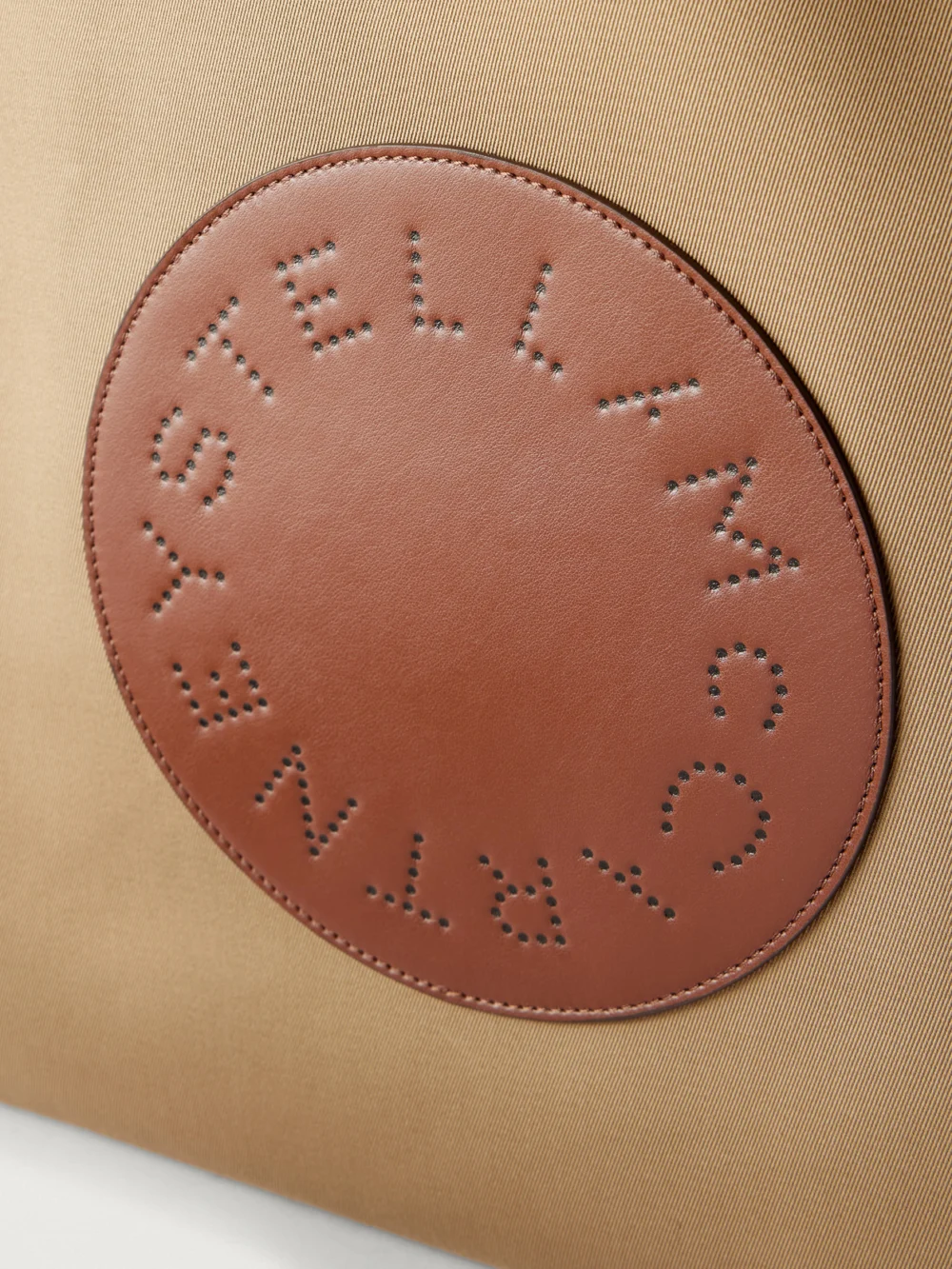 Close-up detail of the Stella McCartney Logo-embossed Reversible Vegetarian Material and Cotton-twill Tote