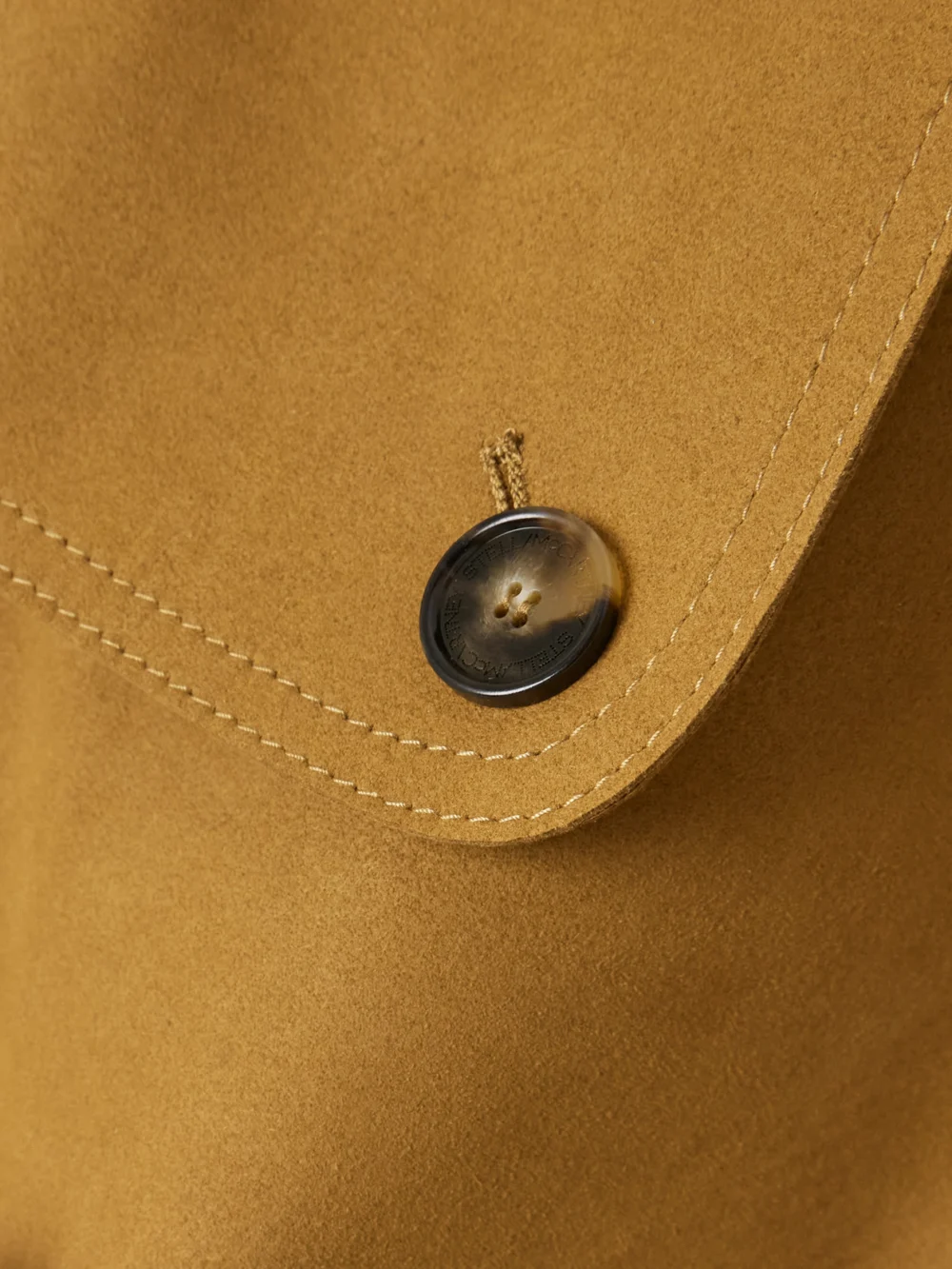 Close-up detail of the Stella McCartney Oversized Double-breasted Belted Brushed Trench Coat