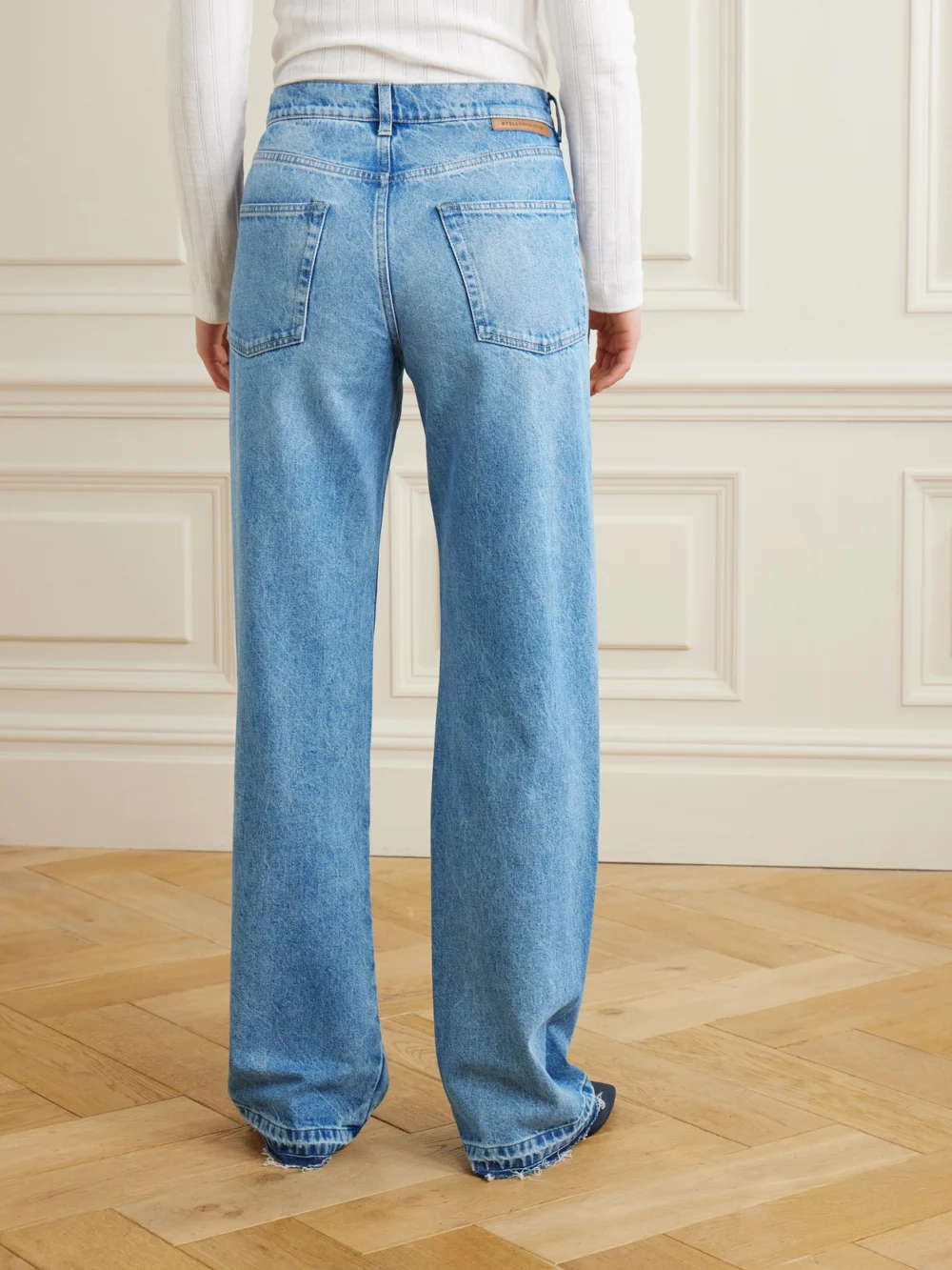 Back view of the Stella McCartney Paneled Distressed Mid-rise Wide-leg Jeans