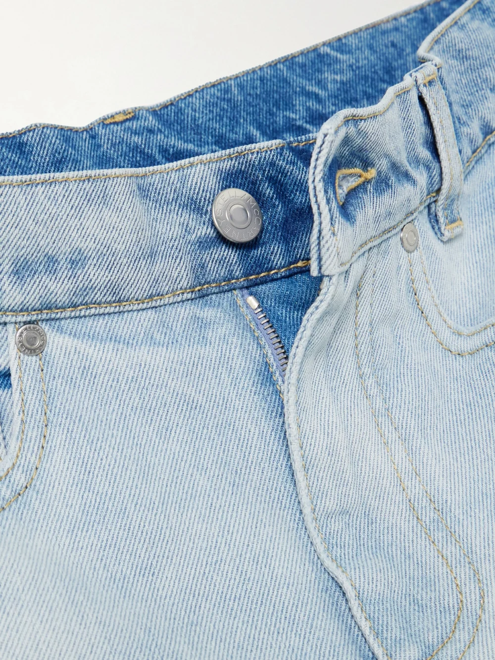 Close-up detail of the Stella McCartney Paneled Distressed Mid-rise Wide-leg Jeans