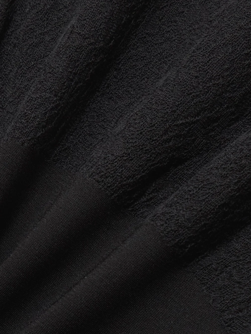 Close-up detail of the Stella McCartney Paneled Lace-trimmed Stretch-knit Turtleneck Maxi Dress