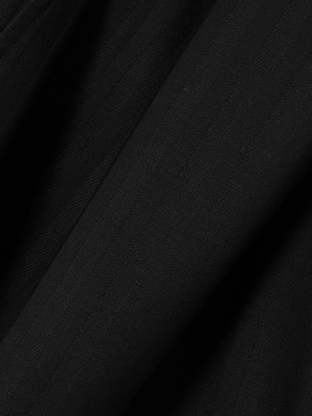 Close-up detail of the Stella McCartney Pleated Wool-jacquard Shorts