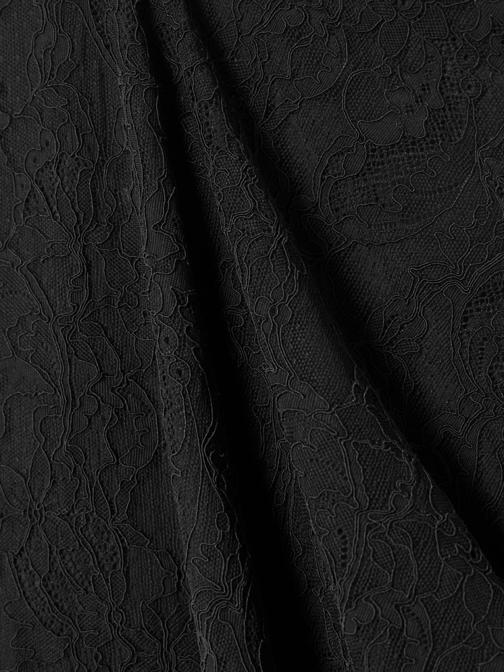 Close-up detail of the Stella McCartney Ruched Stretch Recycled-lace Maxi Dress