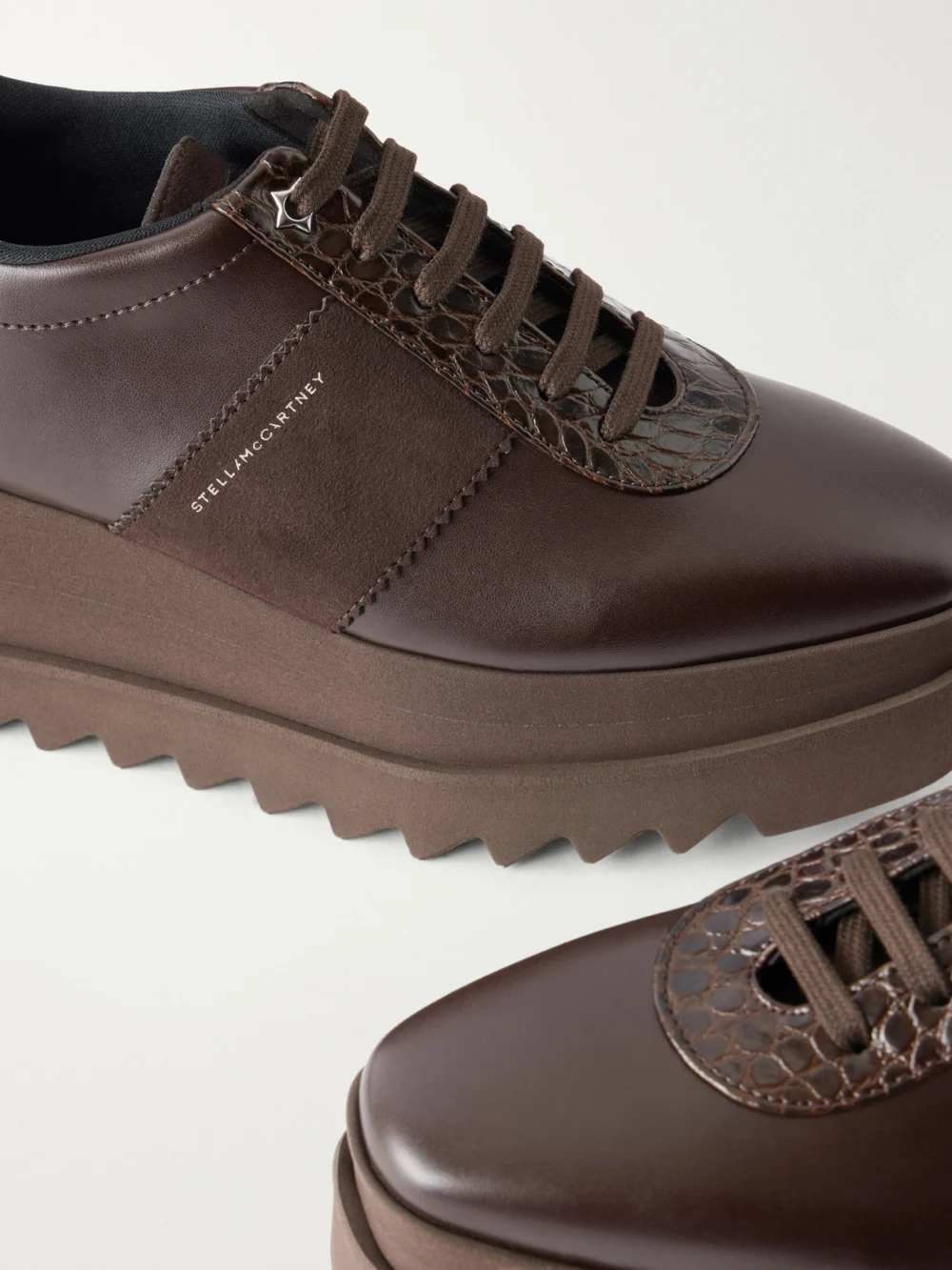 Close-up detail of the Stella McCartney Snake-effect Leather Sneakers
