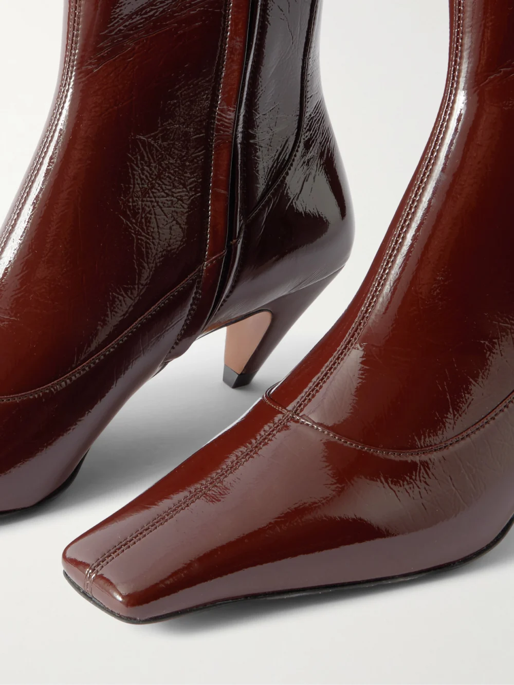 Close-up detail of the Stella McCartney Spur Glossed Ankle Boots