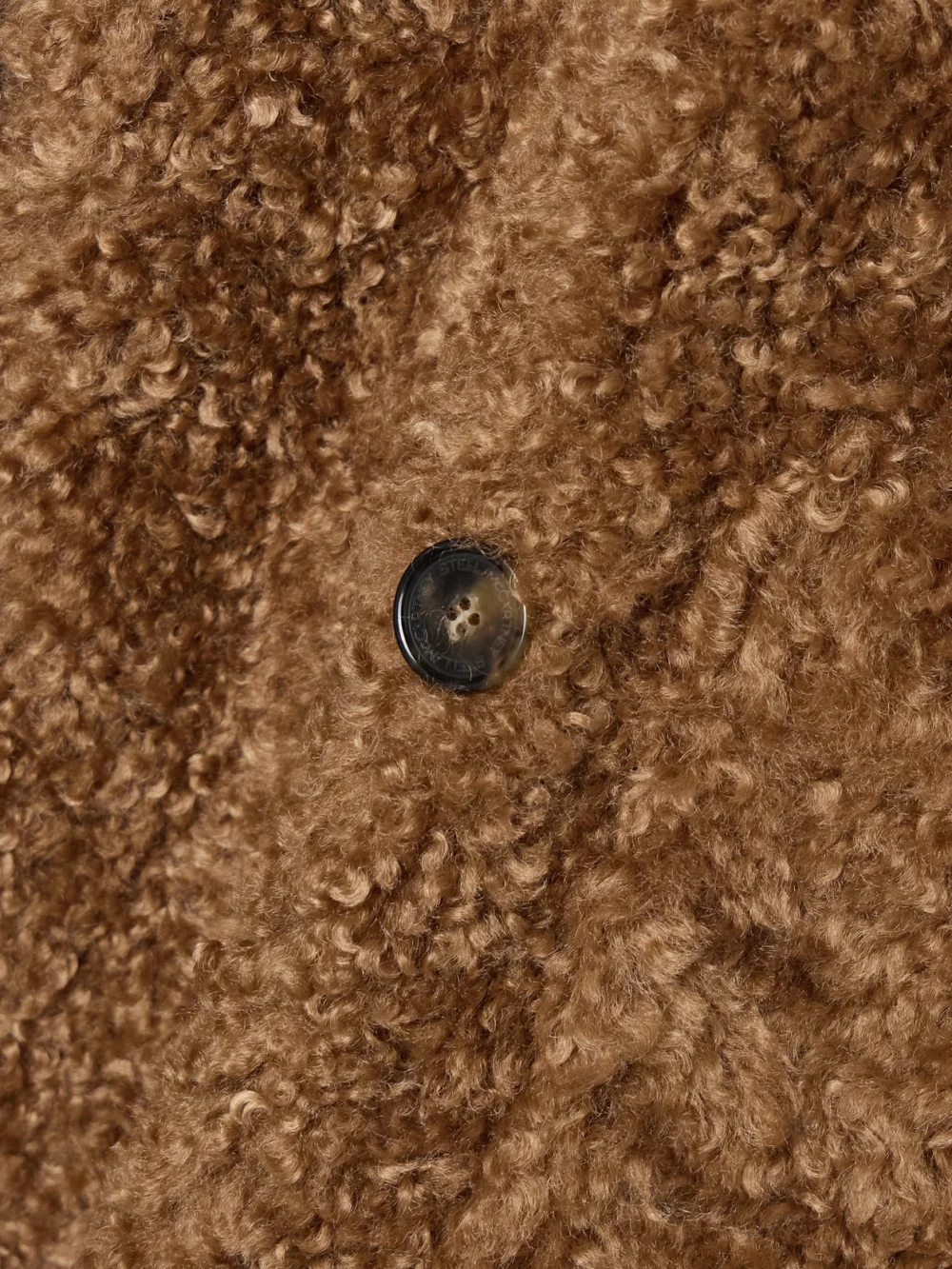 Close-up detail of the Stella McCartney Teddy Belted Double-breasted Faux Shearling Coat