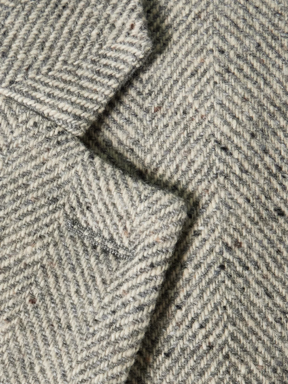 Close-up detail of the Stella McCartney Wool and Silk-blend Herringbone Blazer