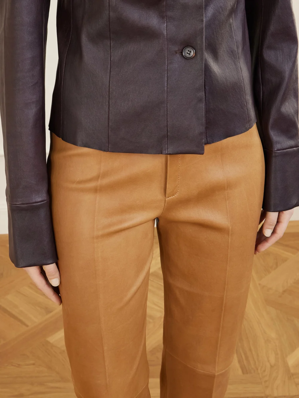 Close-up detail of the Stouls Georgette Leather Slim-leg Pants