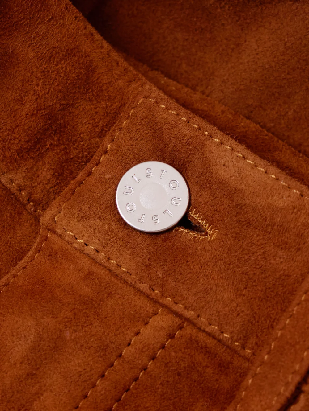 Close-up detail of the Stouls Mythéo Paneled Suede Straight-leg Pants