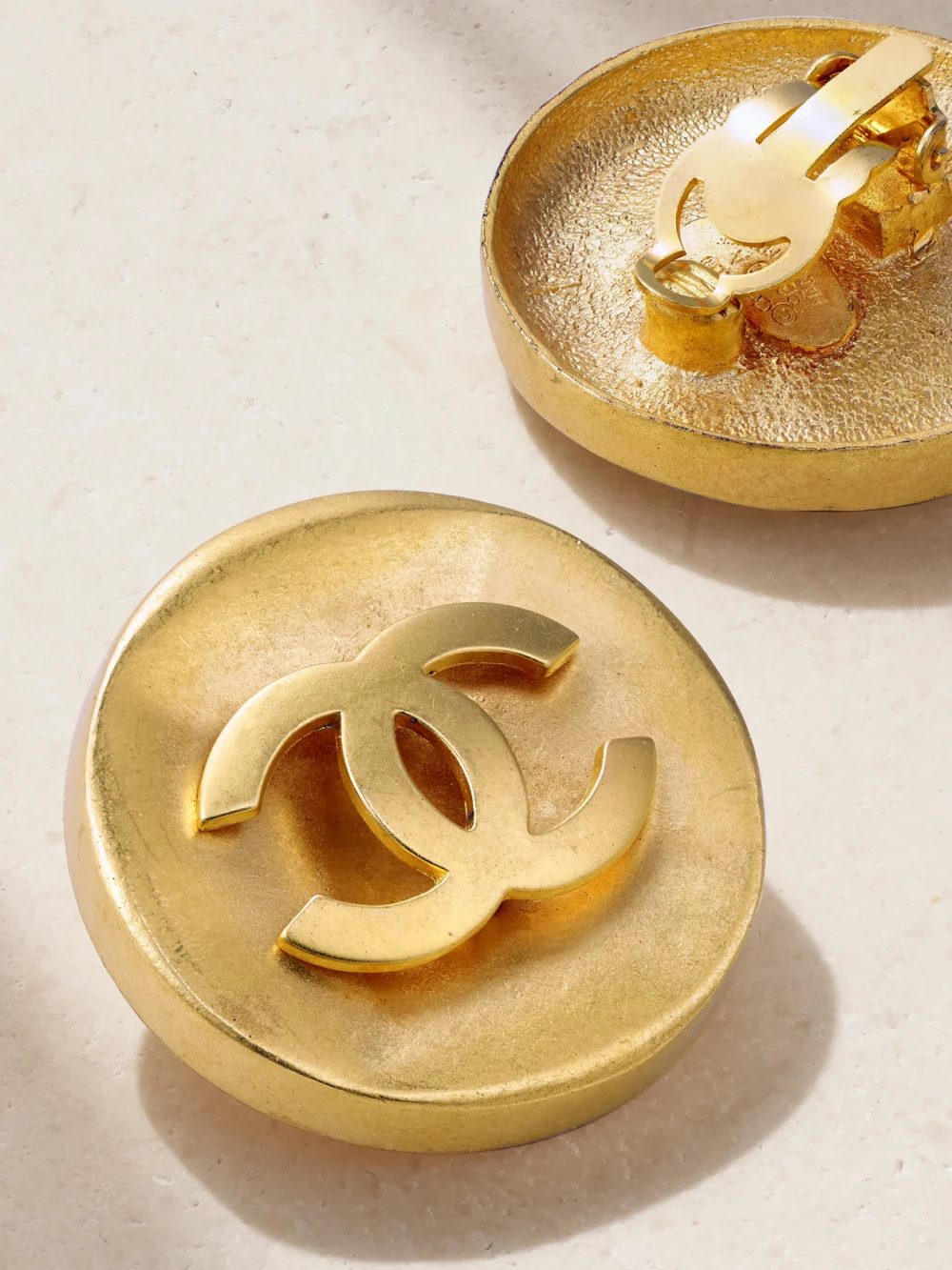 Close-up detail of the Susan Caplan Vintage Gold-plated Clip Earrings