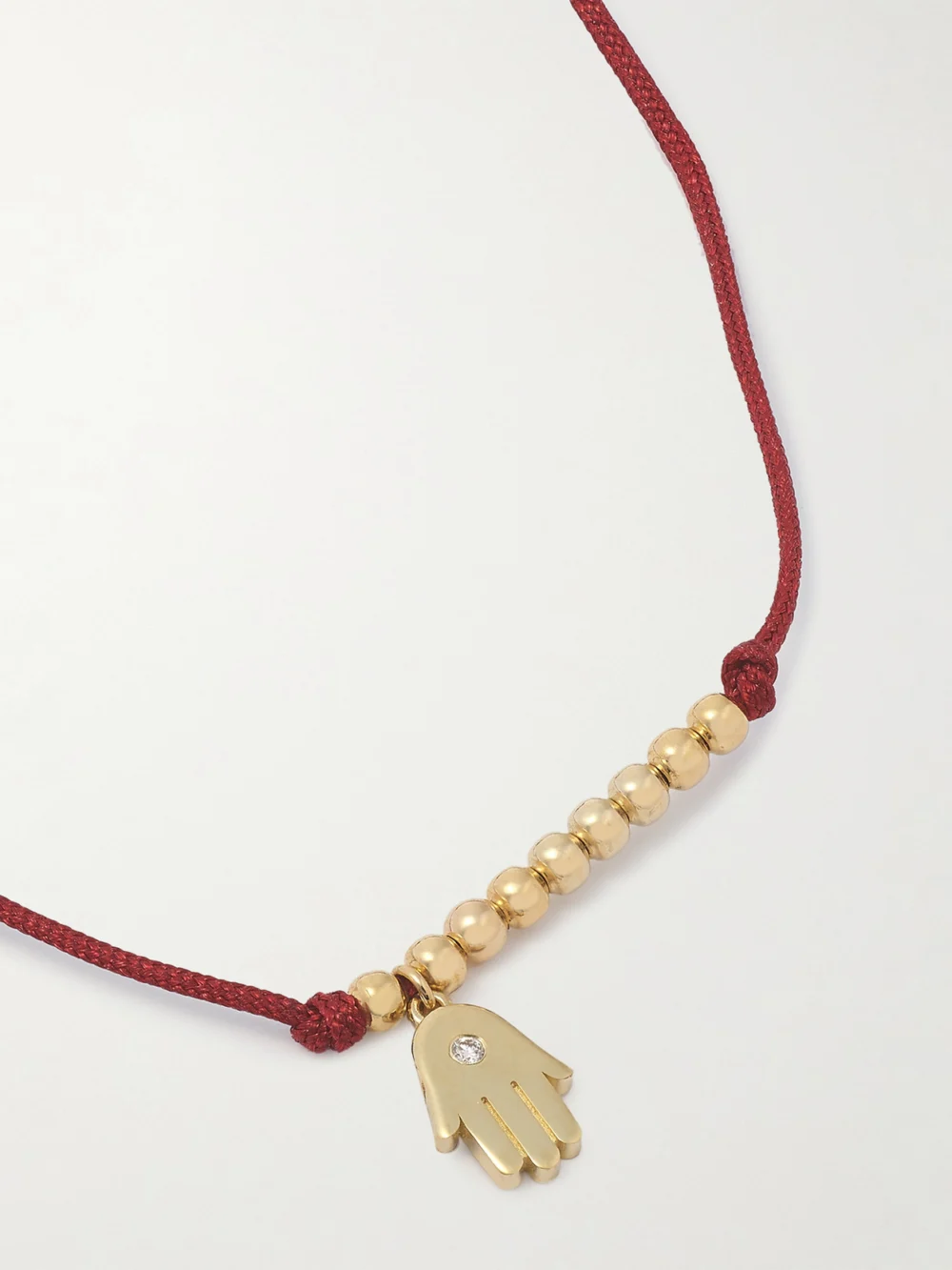 Close-up detail of the Sydney Evan Hamsa 14-karat Gold, Cord and Diamond Bracelet