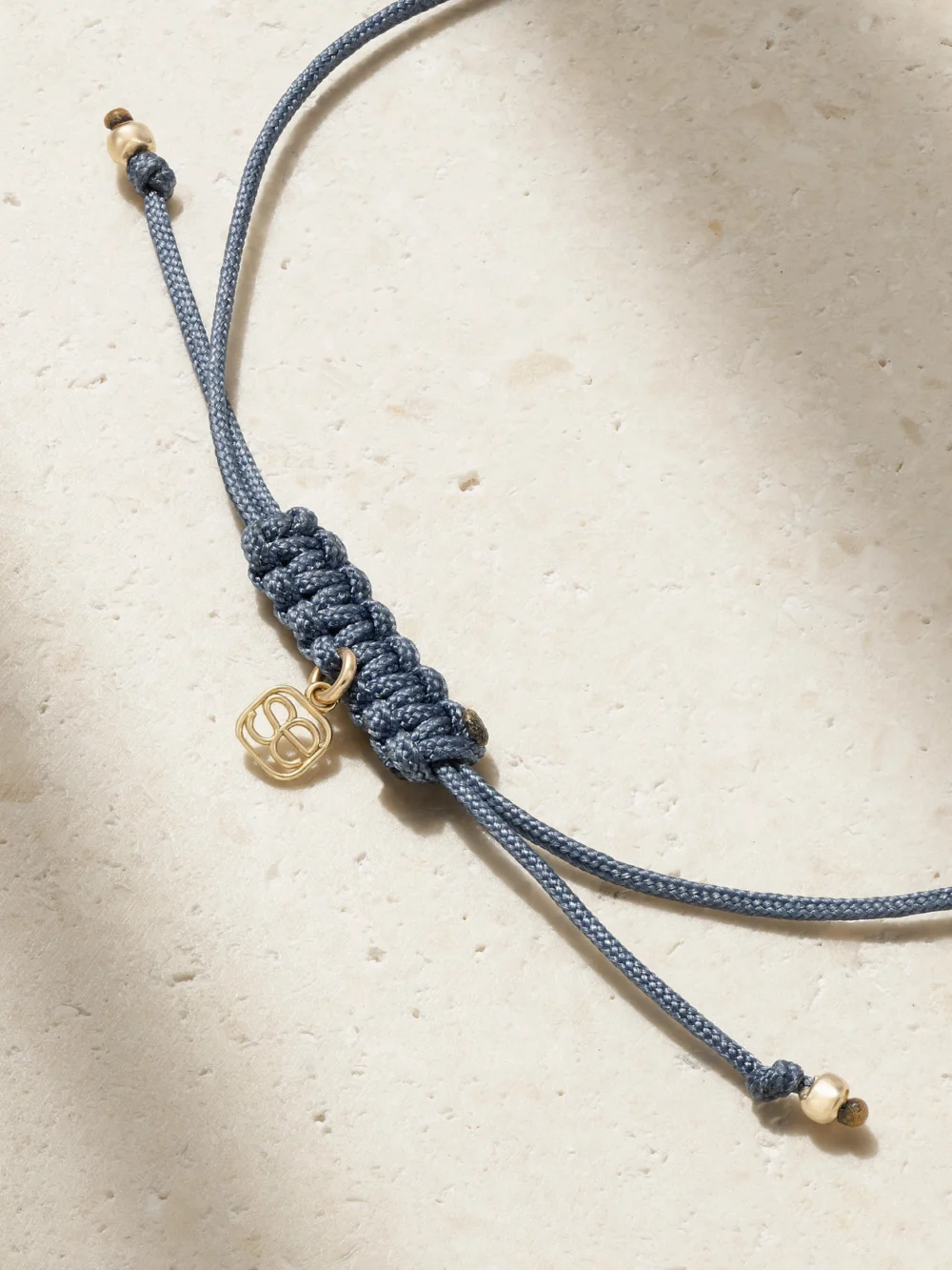 Back view of the Sydney Evan Tiny Evil Eye 14-karat Gold, Cord and Diamond Bracelet