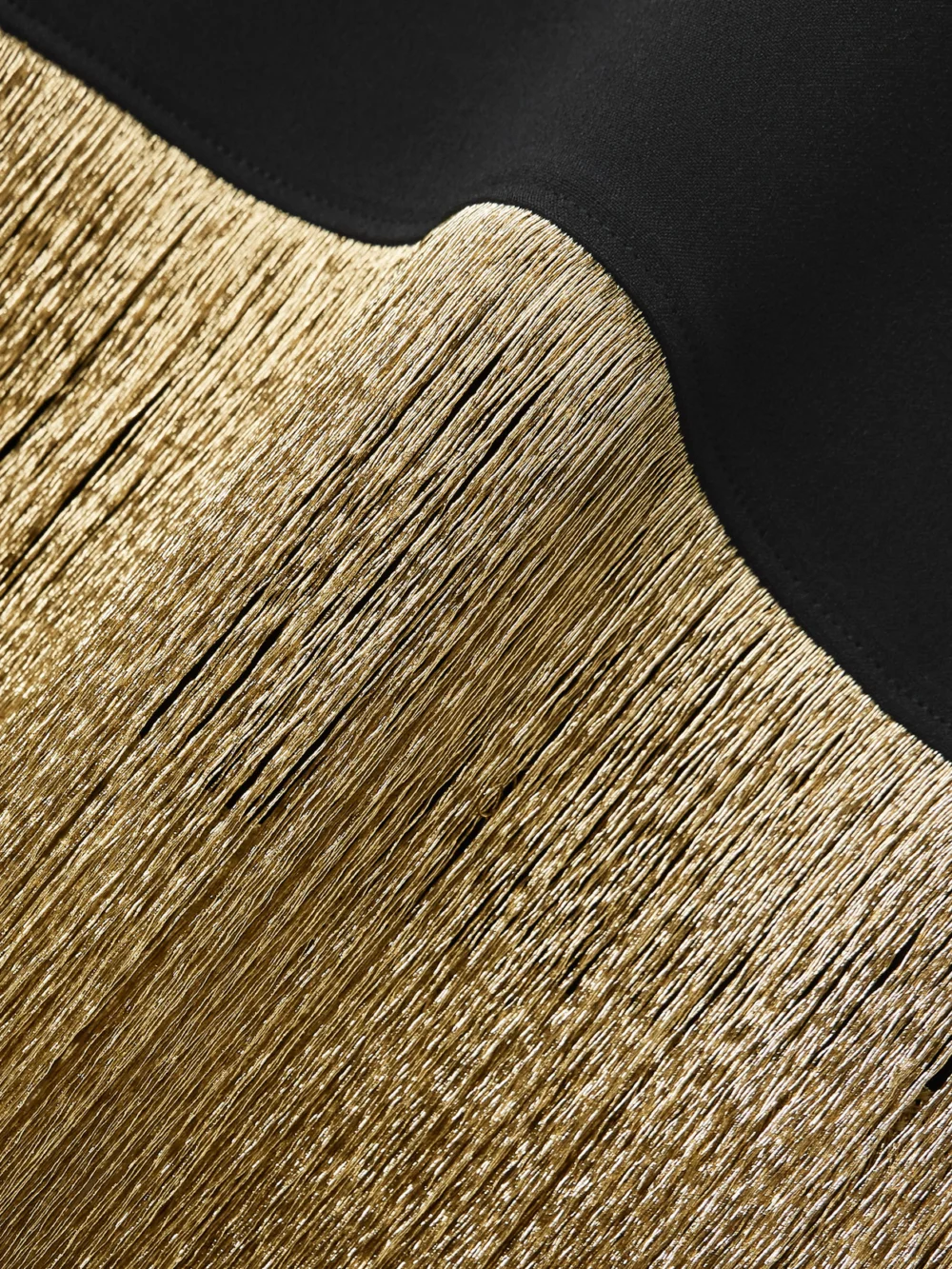 Close-up detail of the Taller Marmo Berlin Fringed Crepe Halterneck Mini Dress