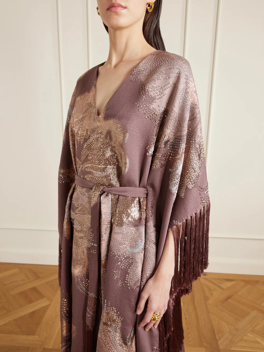 Close-up detail of the Taller Marmo Dawn Royale Belted Fringed Embellished Crepe Kaftan