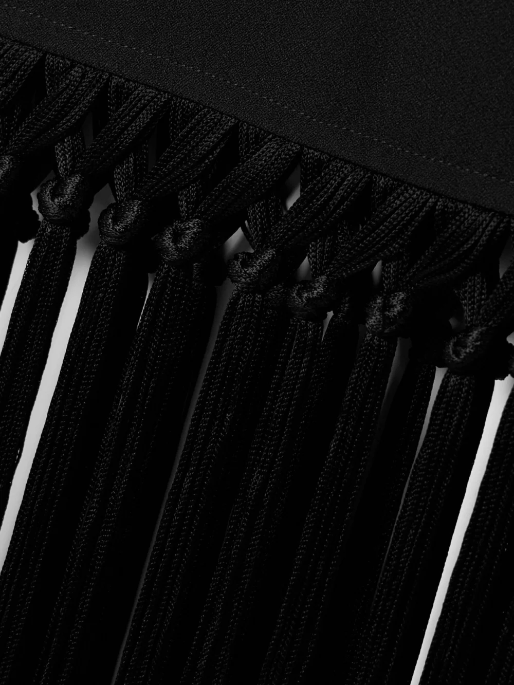 Close-up detail of the Taller Marmo Palermo Fringed Crepe Mini Dress