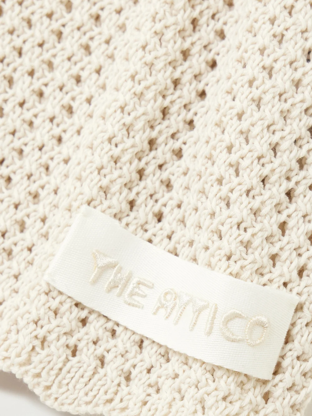 Close-up detail of The Attico Crocheted Cotton Mini Dress