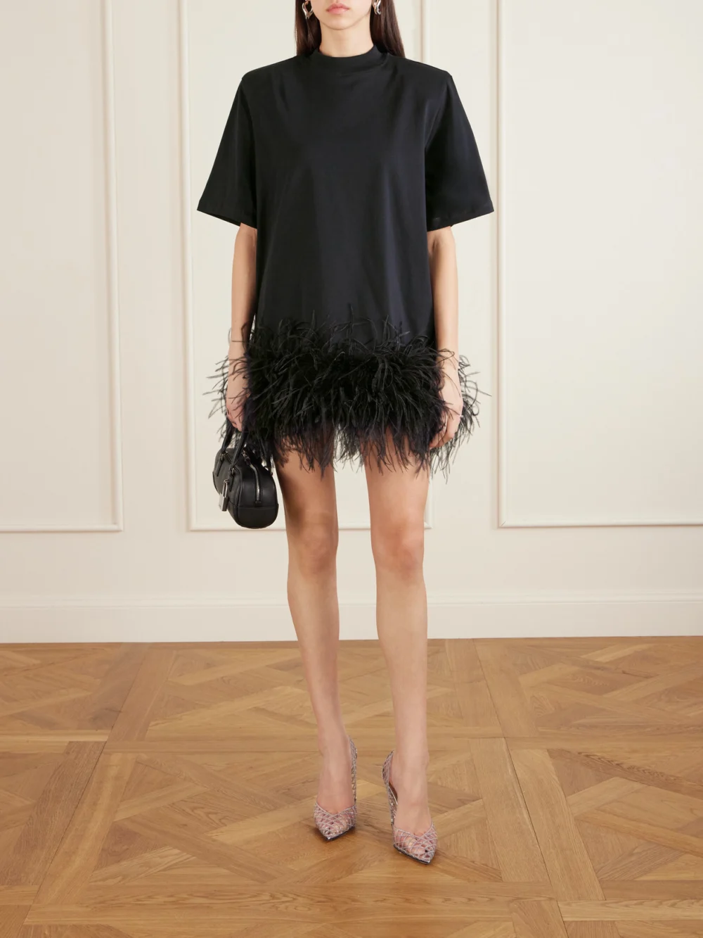 The Attico Feather-trimmed Cotton-jersey Mini Dress, worn by a model
