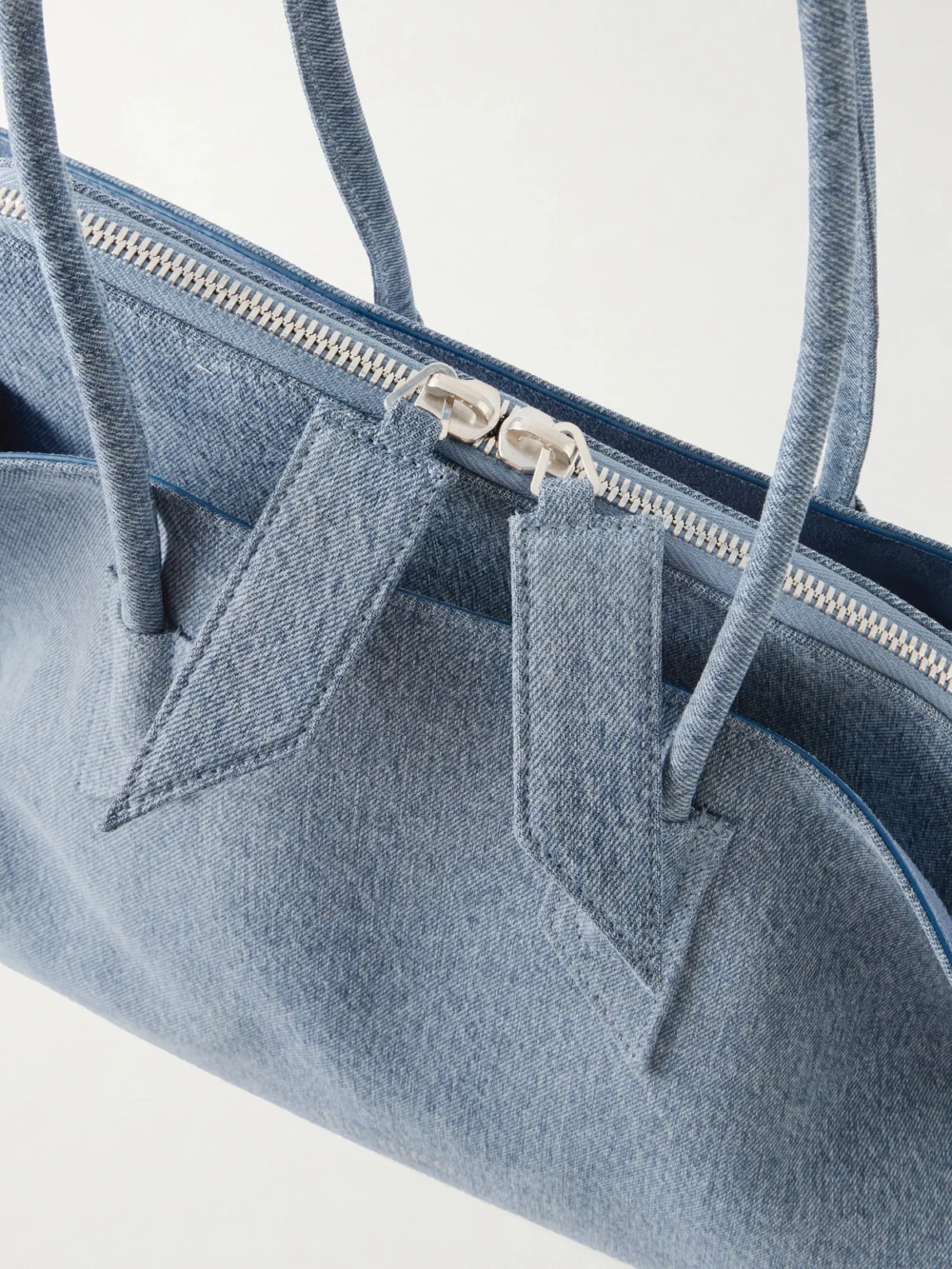 Close-up detail of The Attico La Passegiata Medium Asymmetric Denim Shoulder Bag