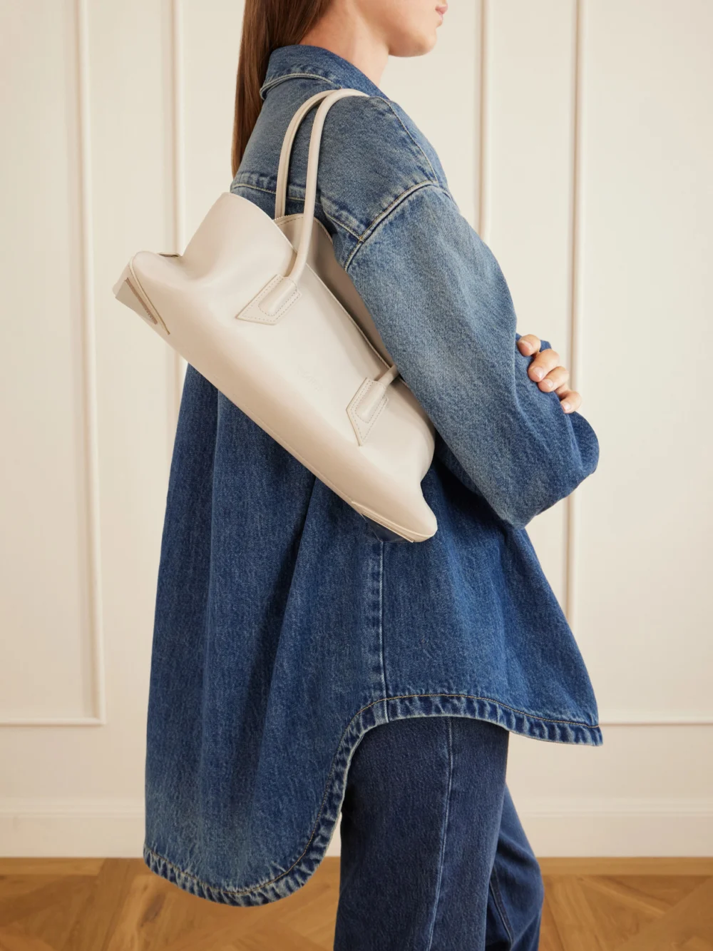 The Attico La Passegiata Small Asymmetric Leather Shoulder Bag, styled view