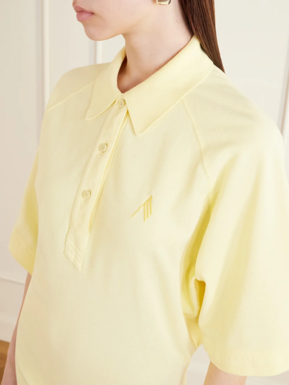 Close-up detail of The Attico Logo-embroidered Cotton-piqué Mini Dress