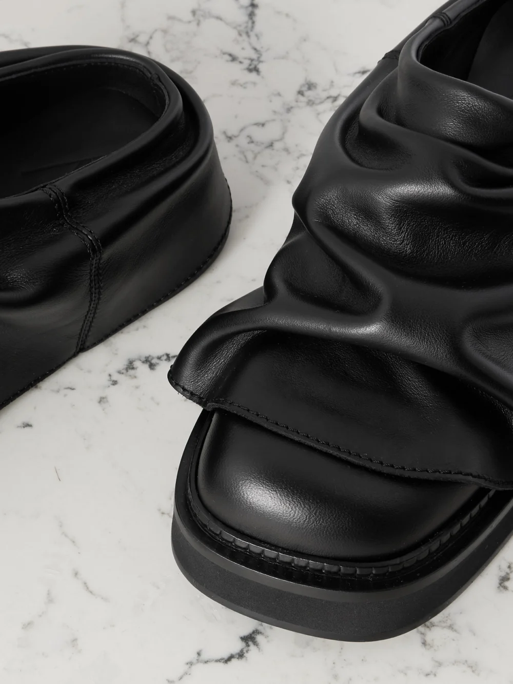 Close-up detail of The Attico Mini Robin Gathered Leather Mules