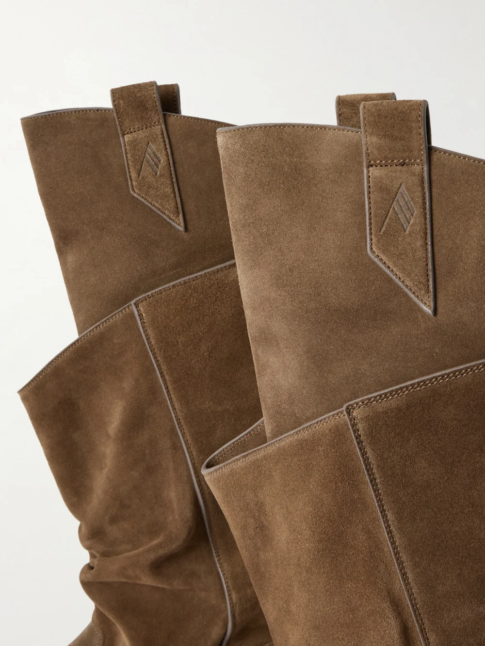 Close-up detail of The Attico Passeggiata Layered Suede Knee Boots
