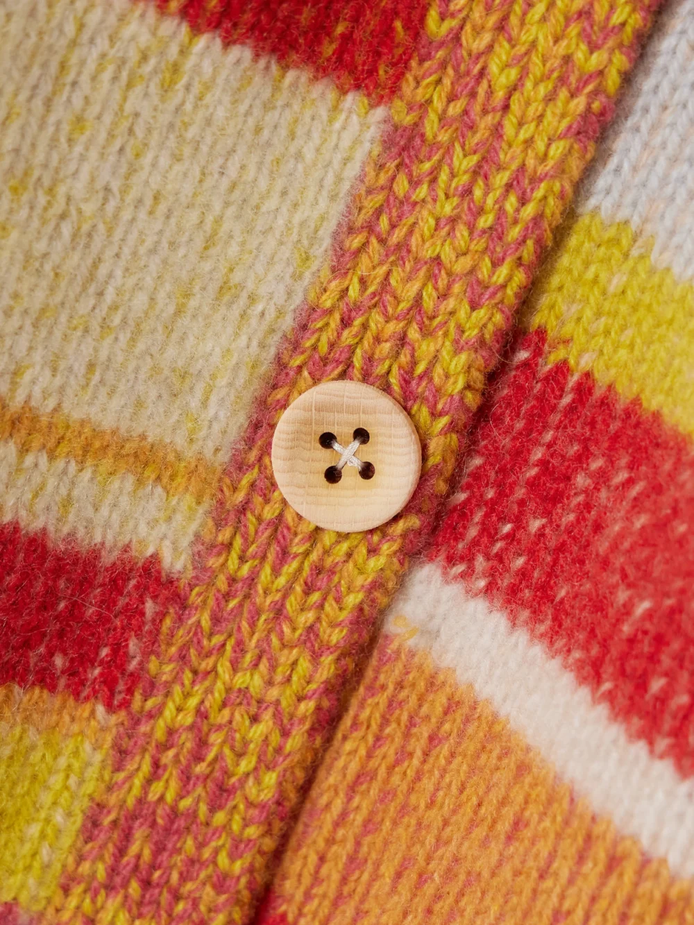 Close-up detail of The Elder Statesman Striped Cashmere Cardigan