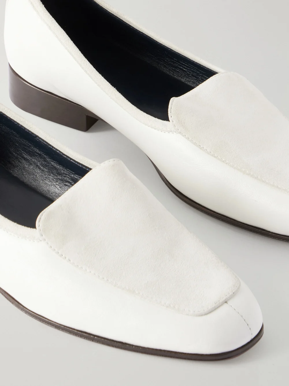 Close-up detail of The Row Adam Glossed-leather Penny Loafers