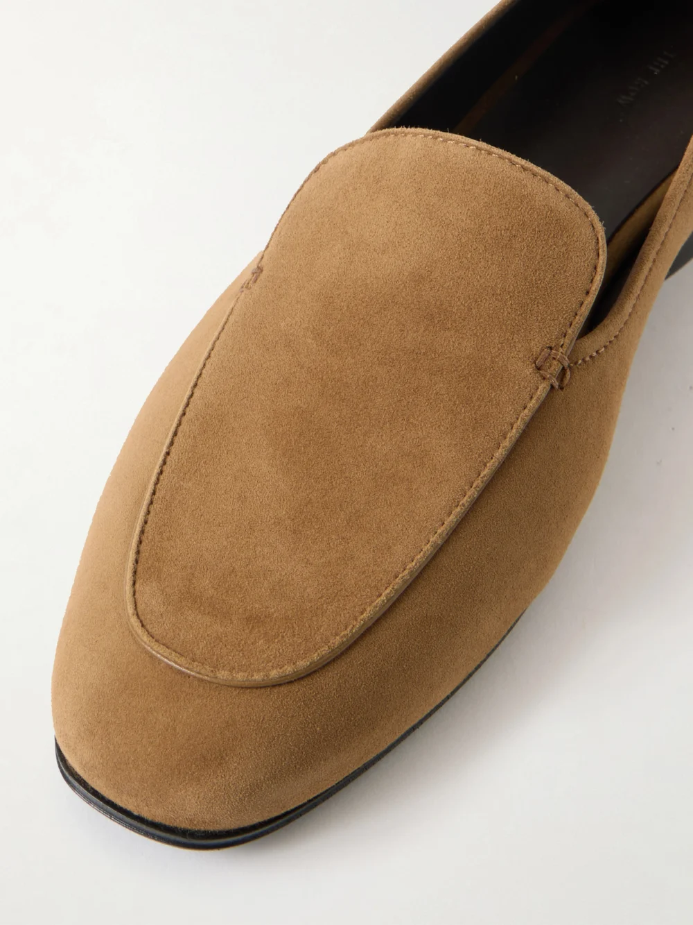 Close-up detail of The Row Adam Suede Loafers