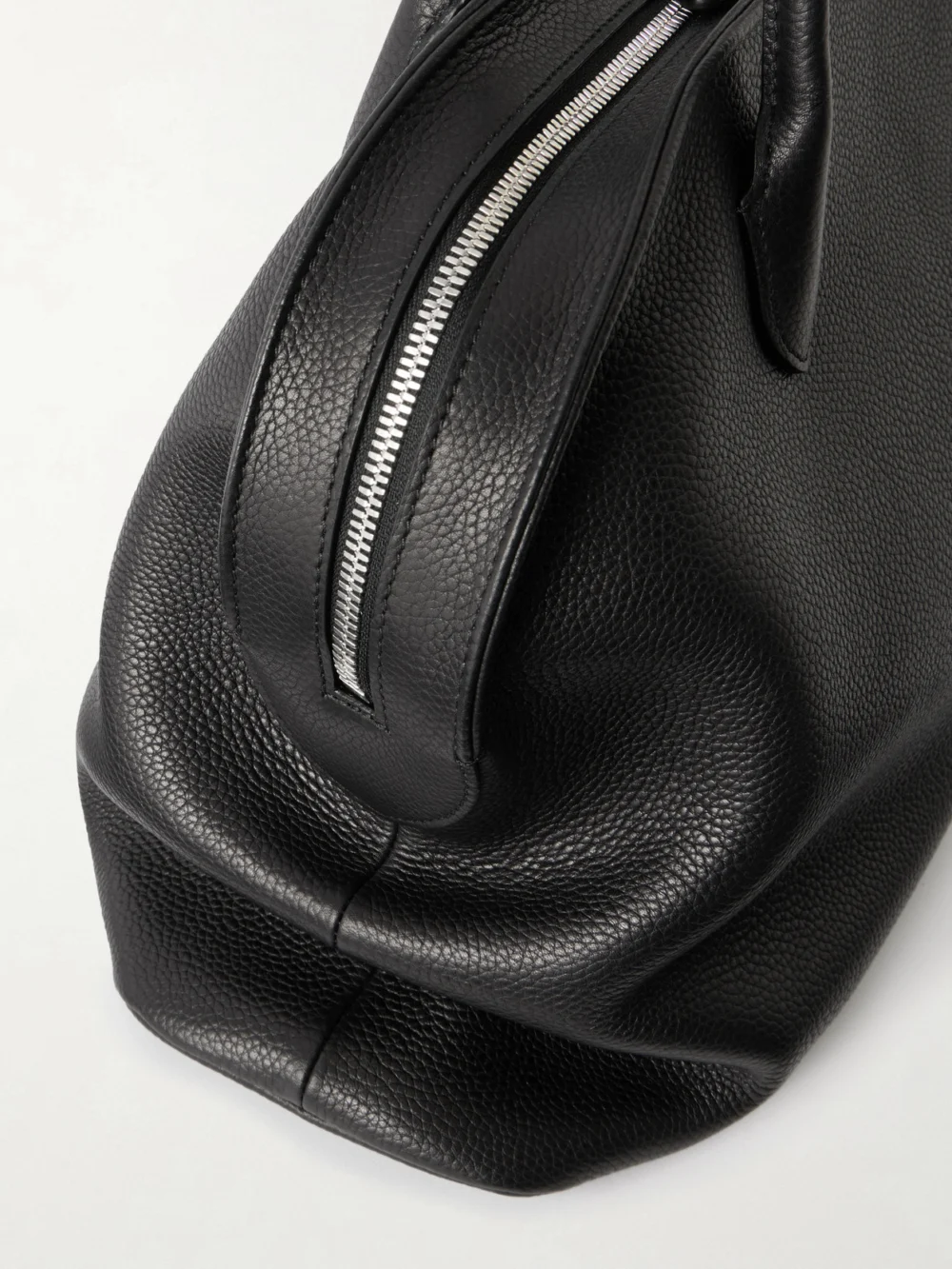 Close-up detail of The Row Agnes 15 Textured-leather Weekend Bag