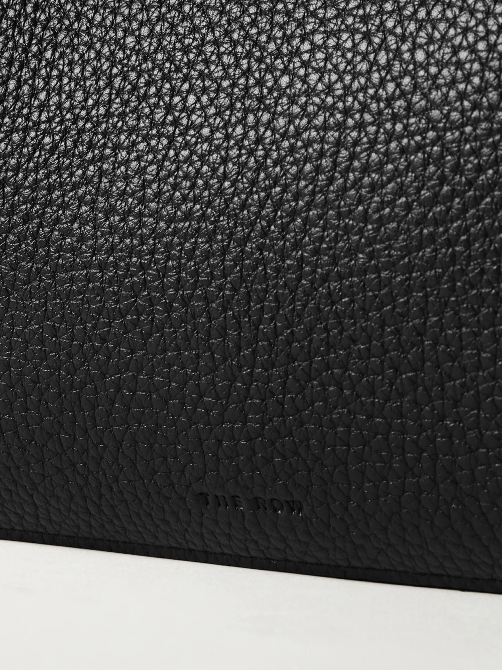 Close-up detail of The Row Alger Textured-leather Shoulder Bag