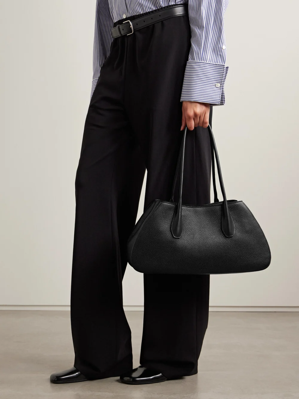 The Row Alger Textured-leather Shoulder Bag, styled view