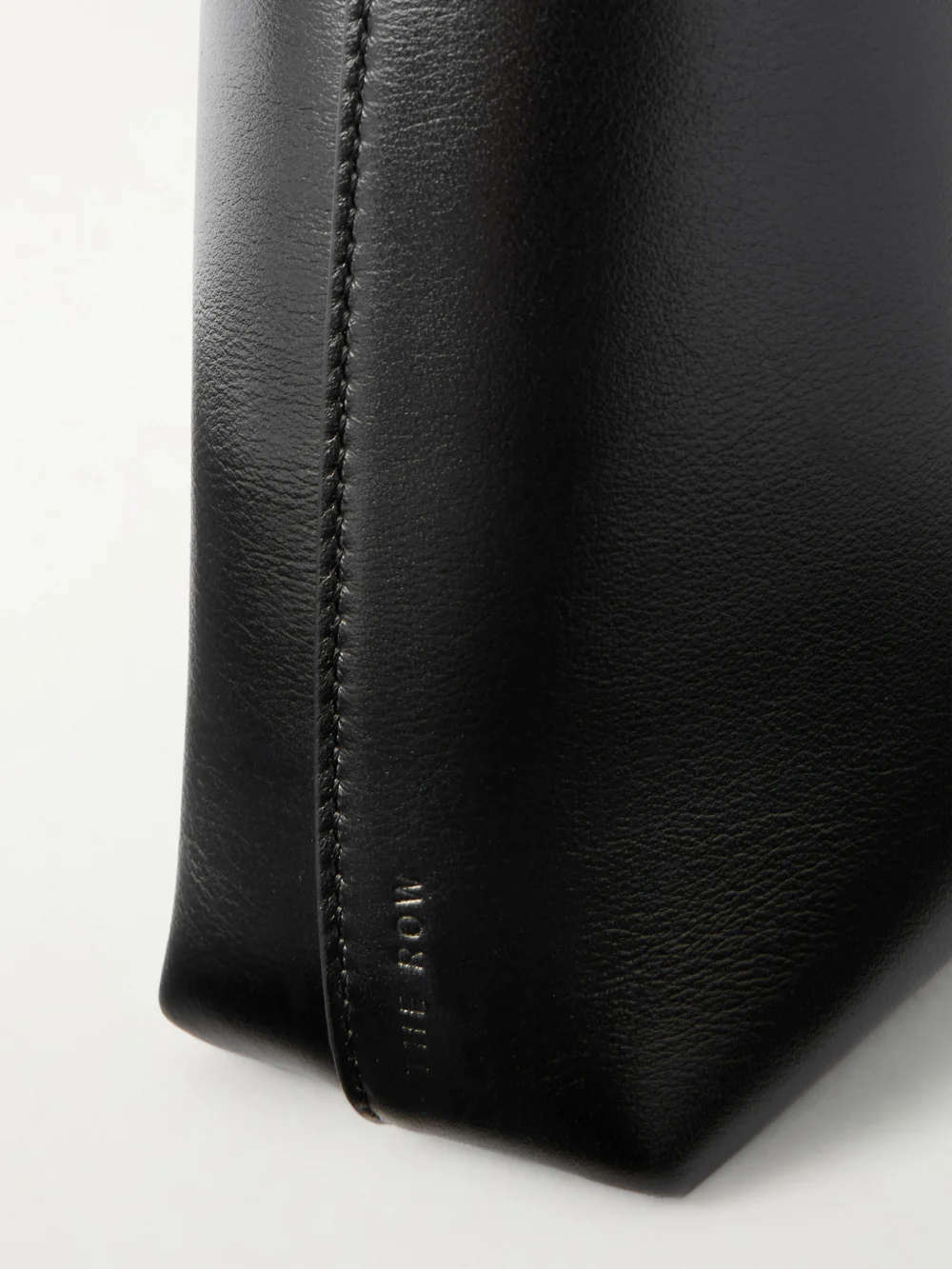Close-up detail of The Row Alma Small Leather Shoulder Bag