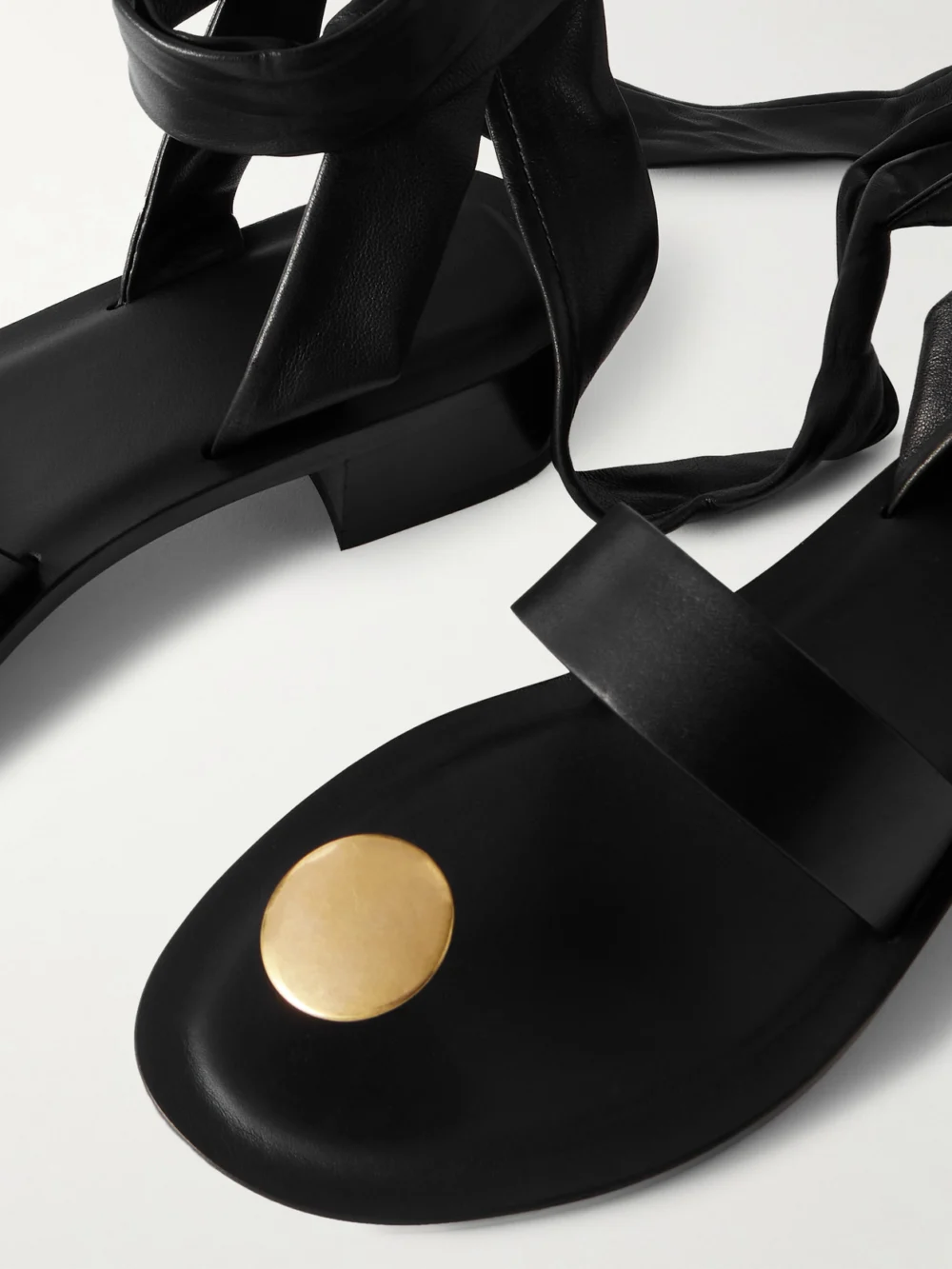 Close-up detail of The Row Band Embellished Leather Sandals