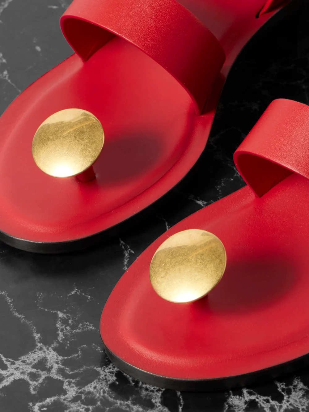 Close-up detail of The Row Band Embellished Leather Sandals