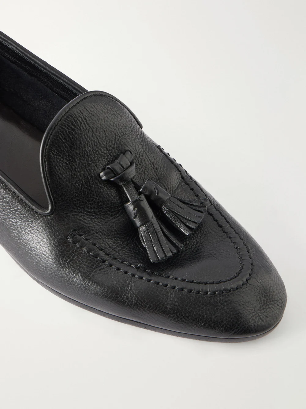 Close-up detail of The Row Caden Tasseled Leather Loafers