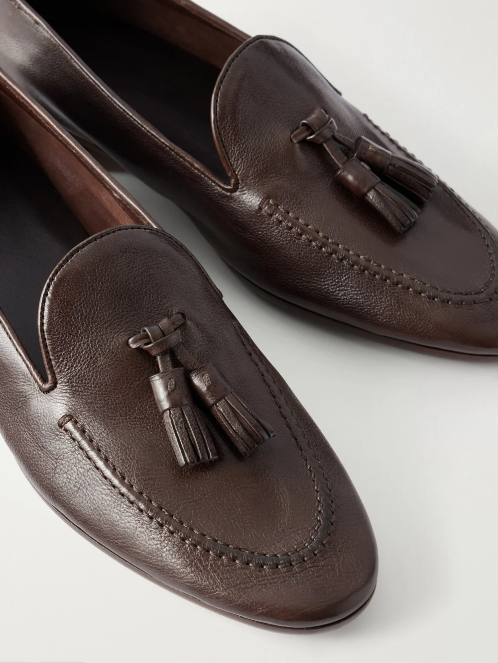 Close-up detail of The Row Caden Tasseled Leather Loafers