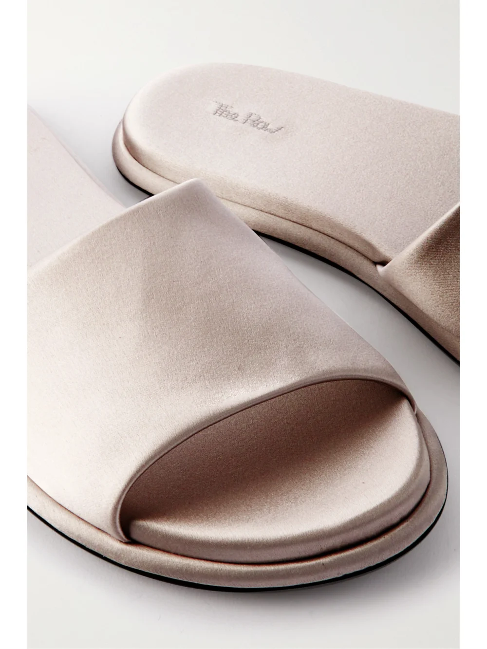 Close-up detail of The Row Canal Slipper Satin Slides
