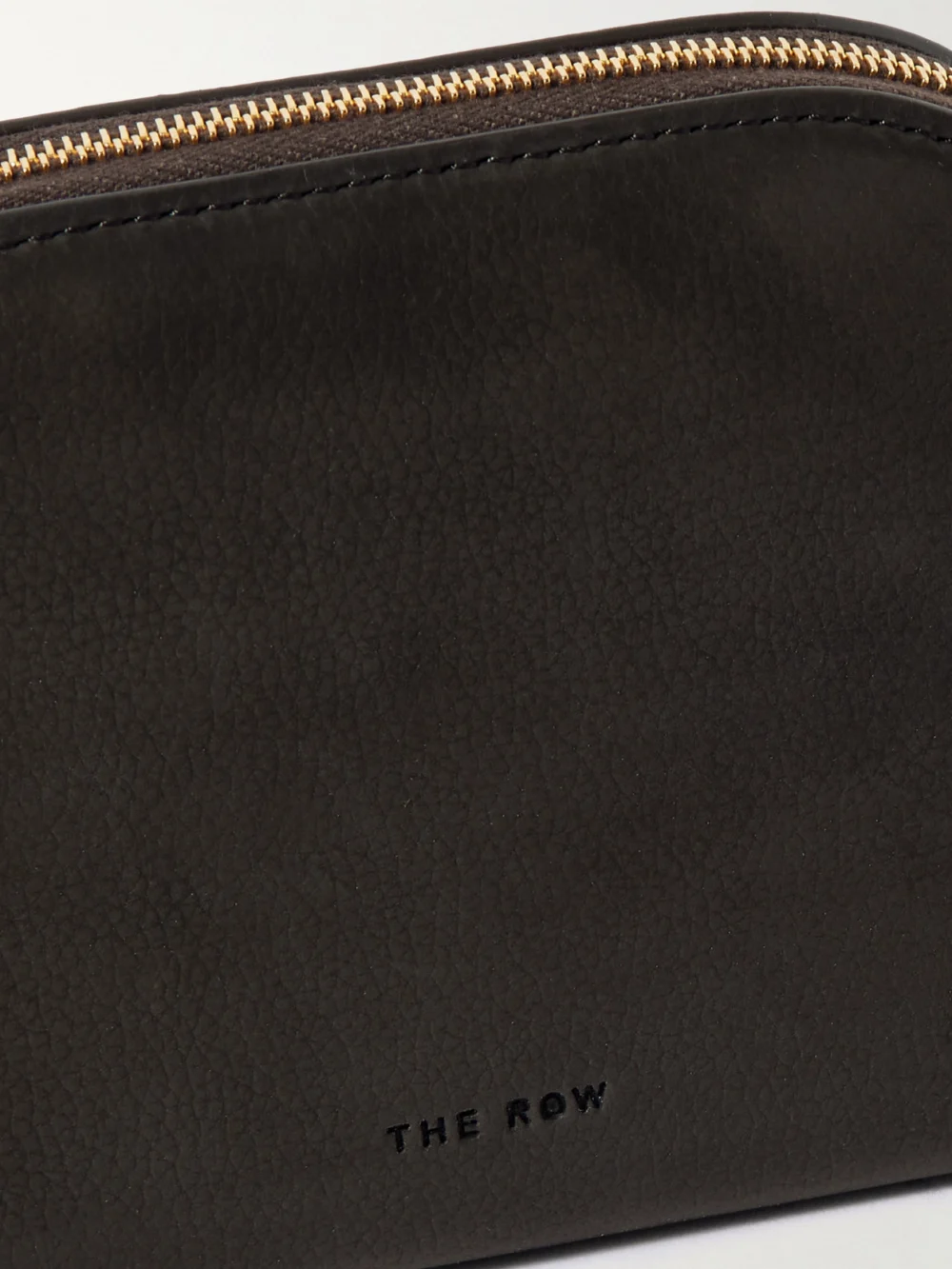 Close-up detail of The Row Devon Mini Nubuck Pouch