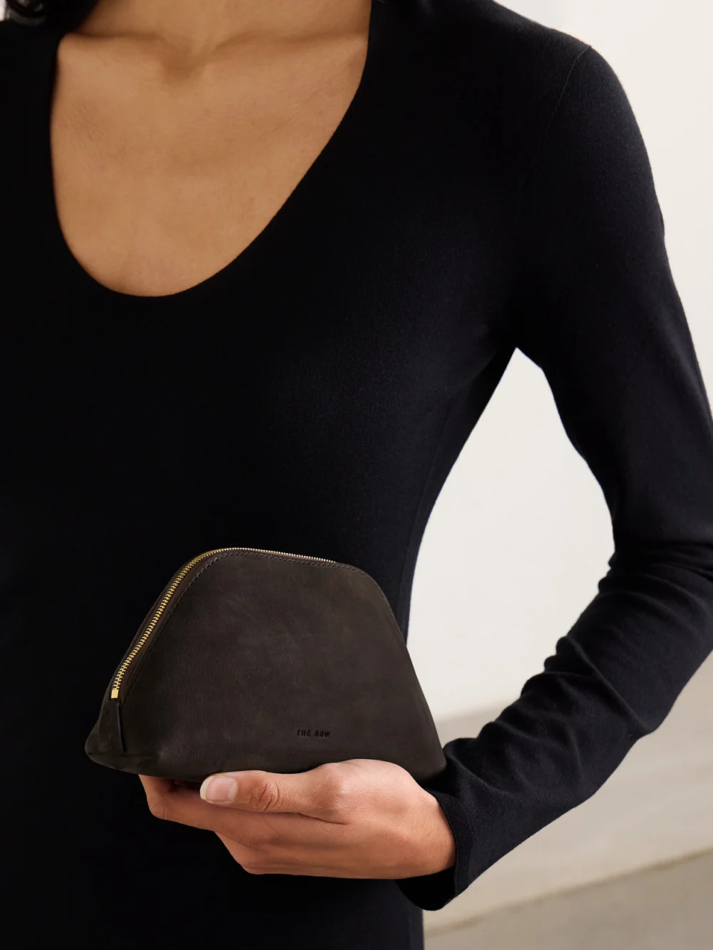 The Row Devon Mini Nubuck Pouch, styled view