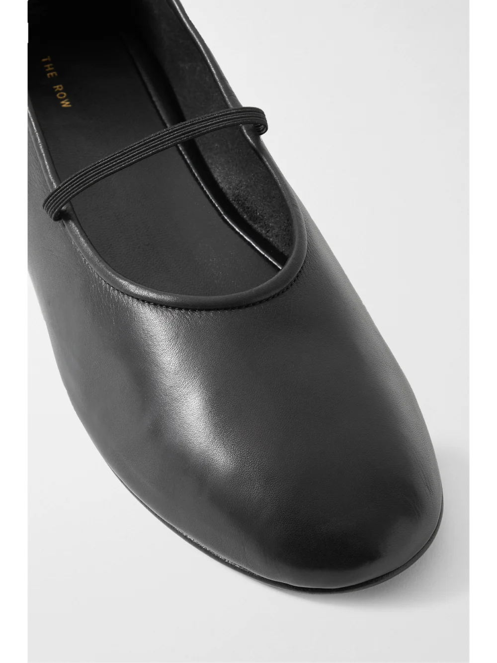 Close-up detail of The Row Elastic Leather Ballet Flats