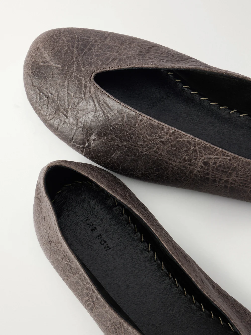 Close-up detail of The Row Fay Leather Ballet Flats