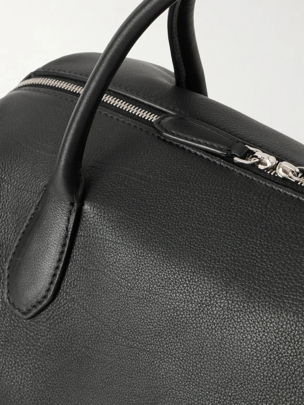 Close-up detail of The Row Faye Textured-leather Tote
