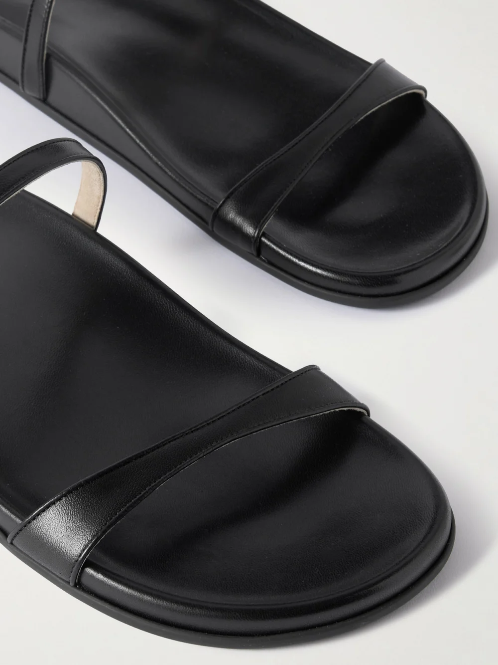 Close-up detail of The Row Hugh Leather Slides