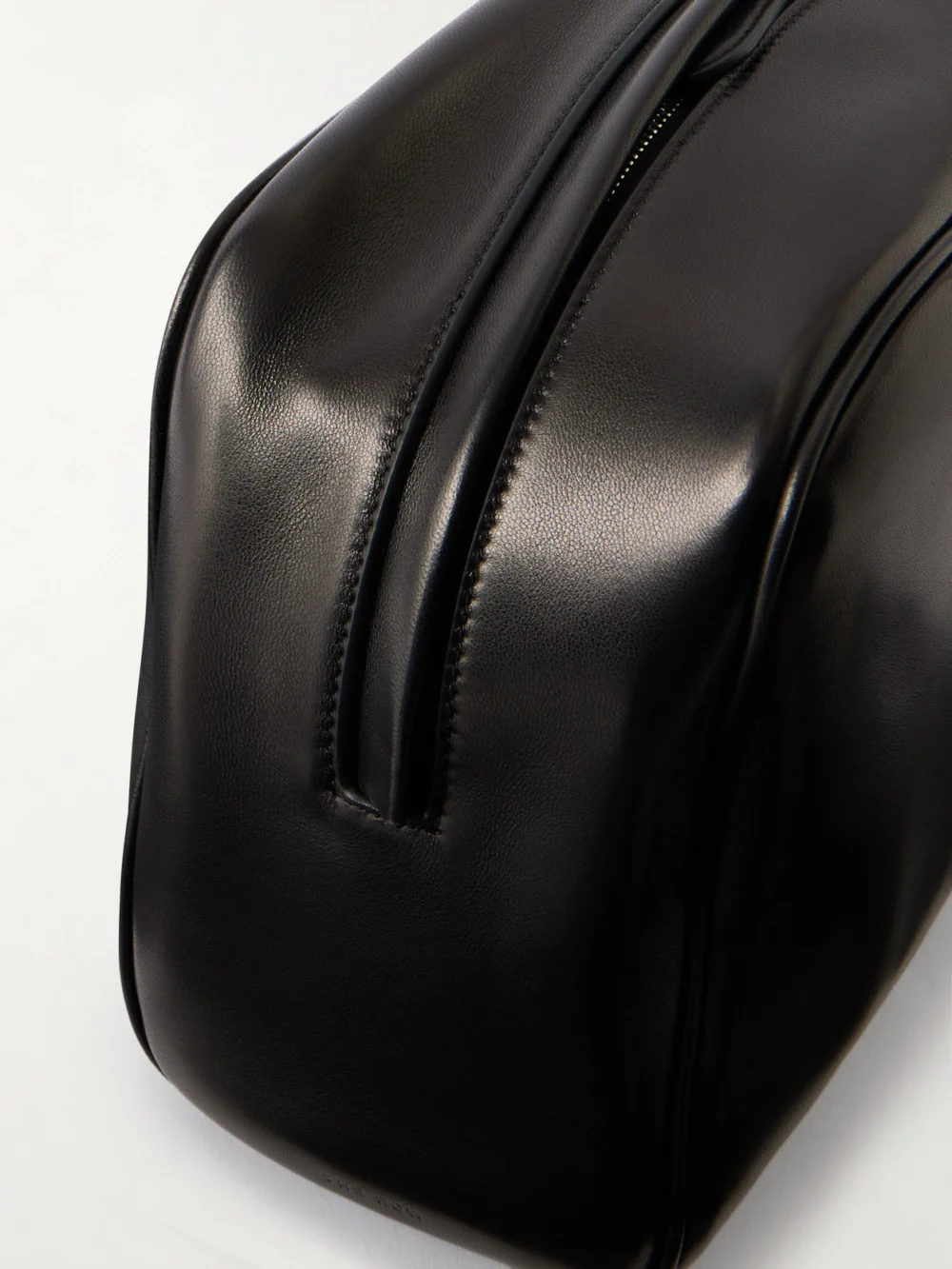Close-up detail of The Row Leila Leather Clutch